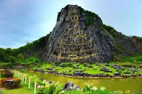 The golden Buddha image carved into Khao Chi Chan cliff near Pattaya